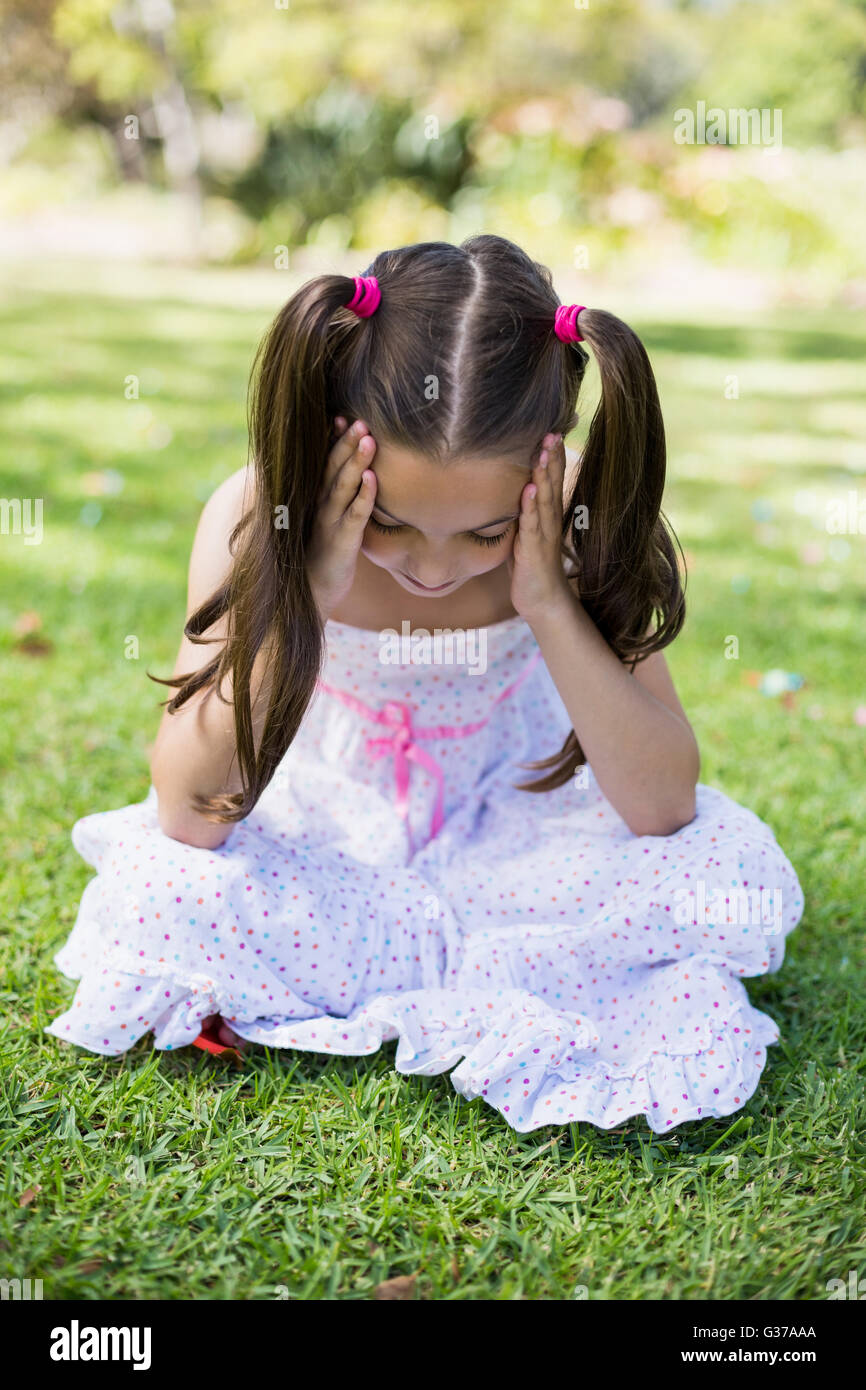 Sad girl sitting grass hi-res stock photography and images - Alamy