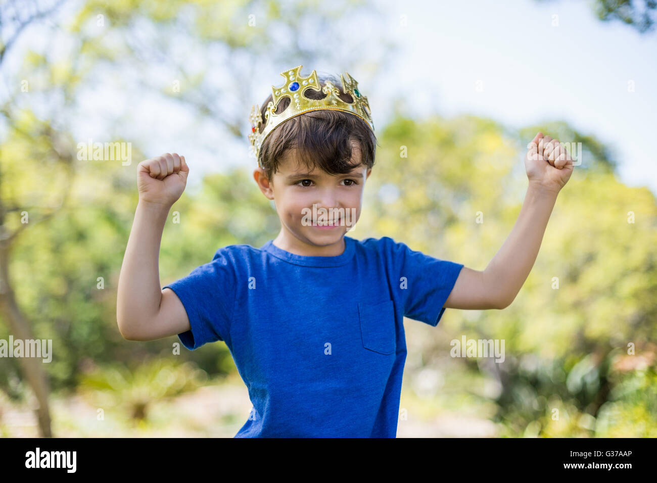 Boy clenching his fists in excitement Stock Photo