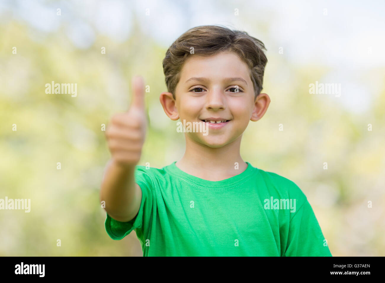 Young boy giving a thumbs up Stock Photo - Alamy