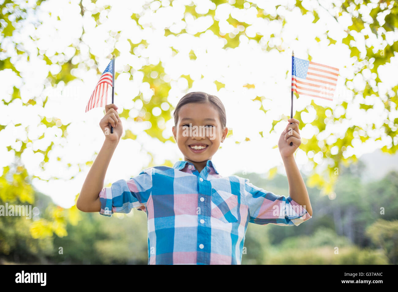 Girl holding an American flag Stock Photo - Alamy