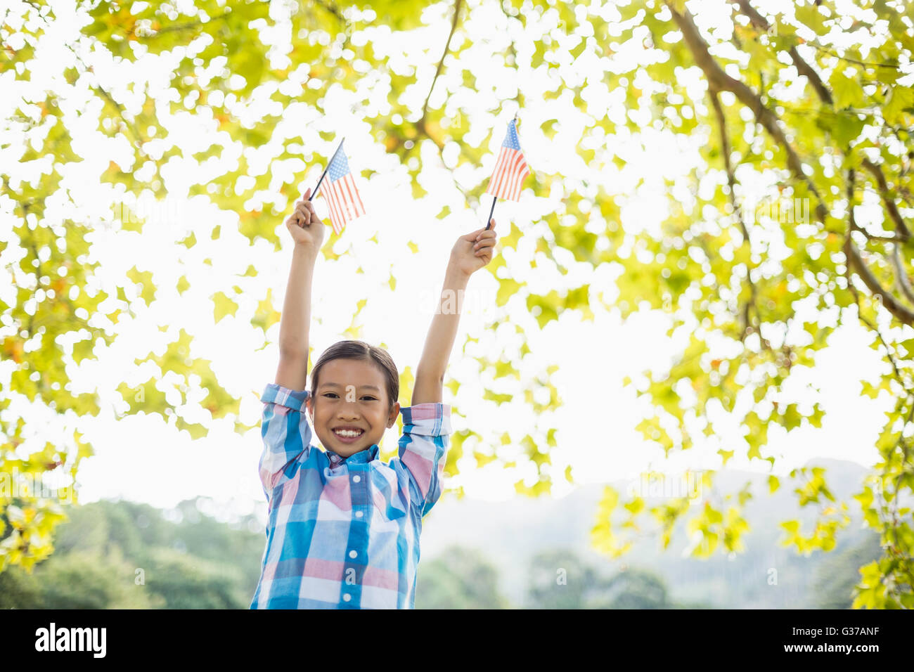 Girl holding an American flag Stock Photo - Alamy