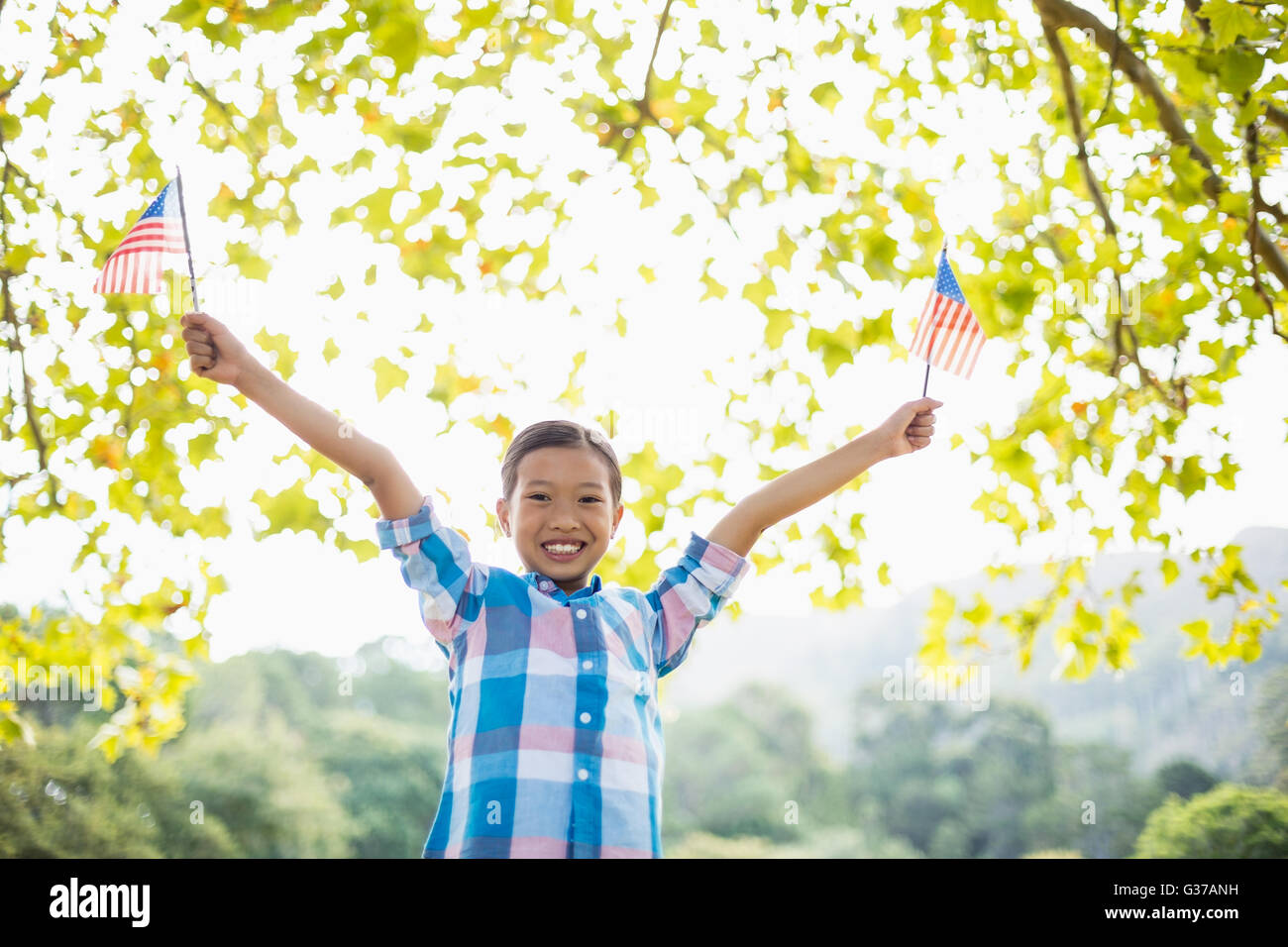 Girl holding an American flag Stock Photo - Alamy