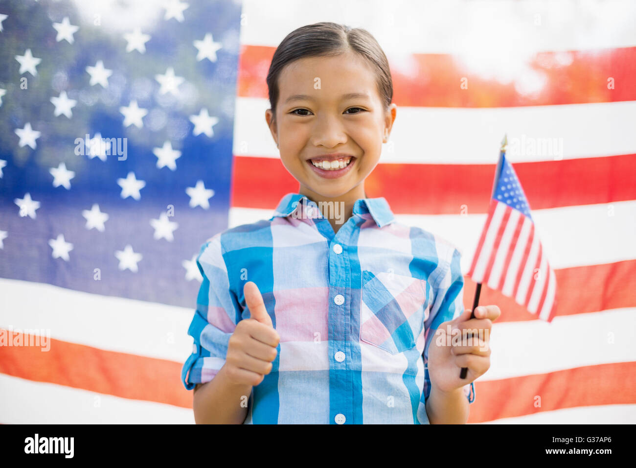 Young girl holding American flag Stock Photo - Alamy