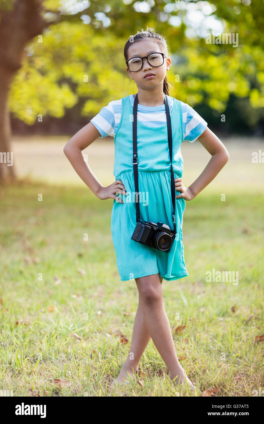 Portrait of girl standing with hand on hip Stock Photo - Alamy