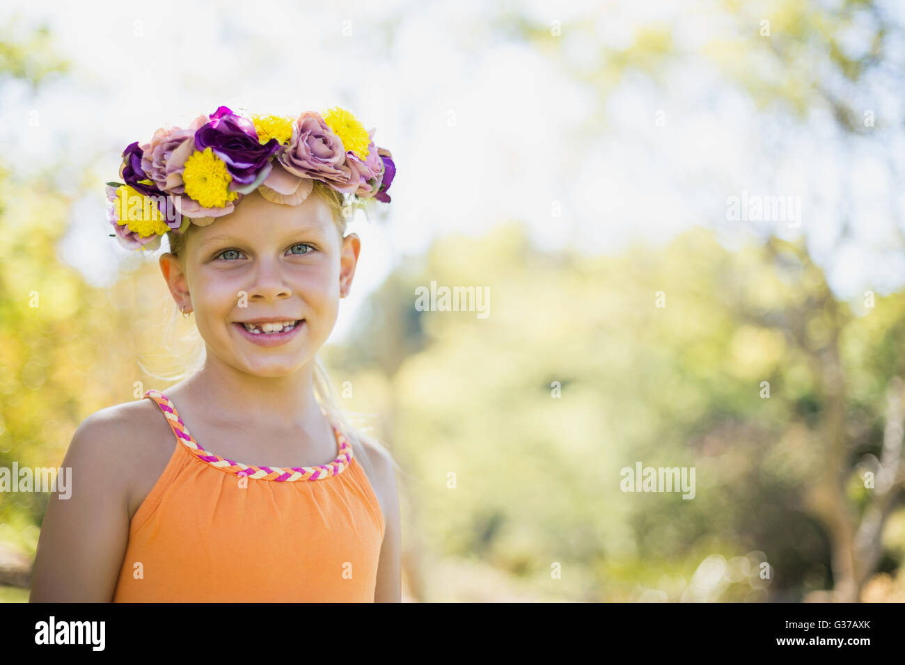 Portrait of girl smiling in park Stock Photo - Alamy