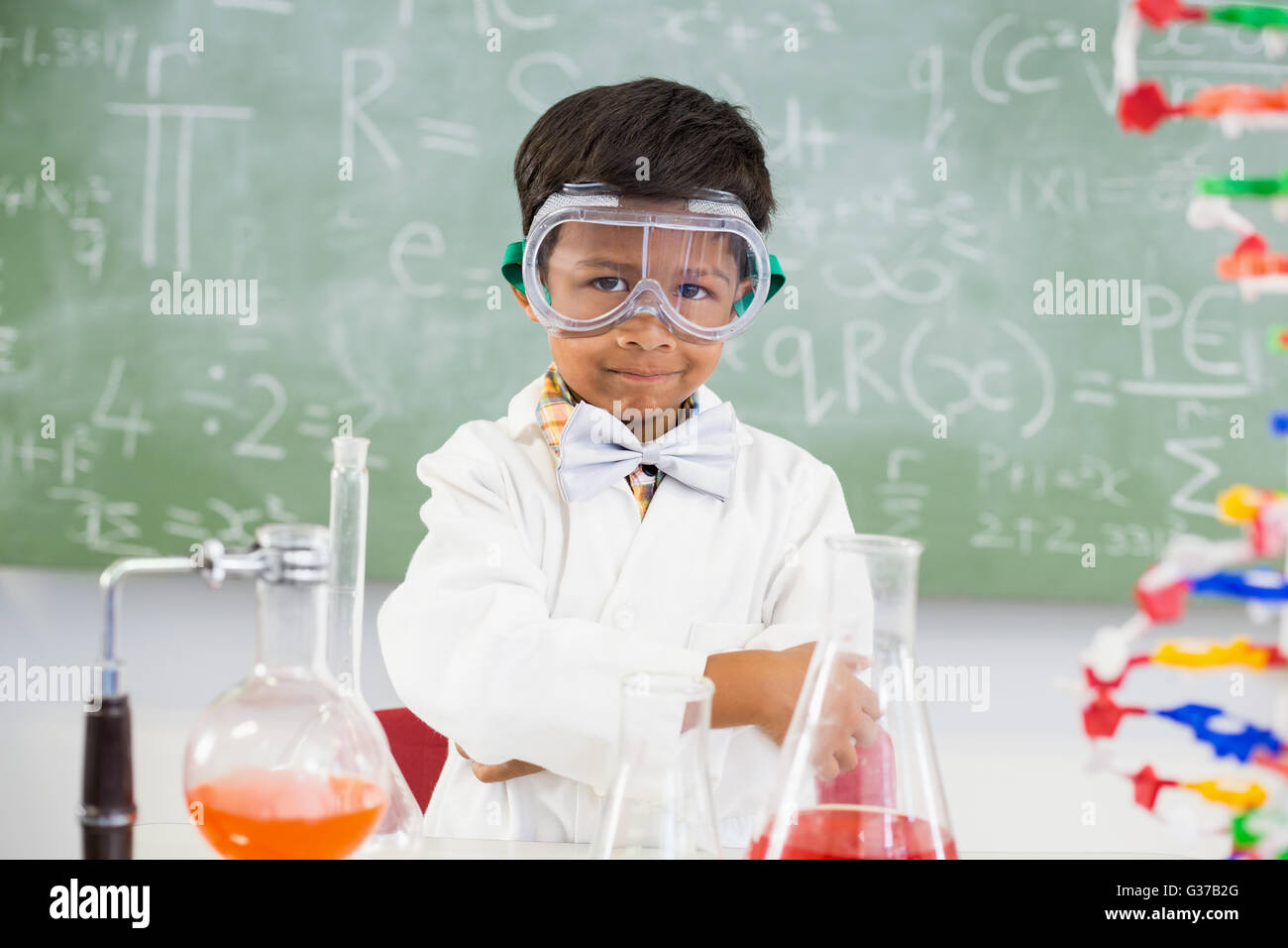 Portrait of schoolboy doing a chemical experiment in laboratory Stock ...