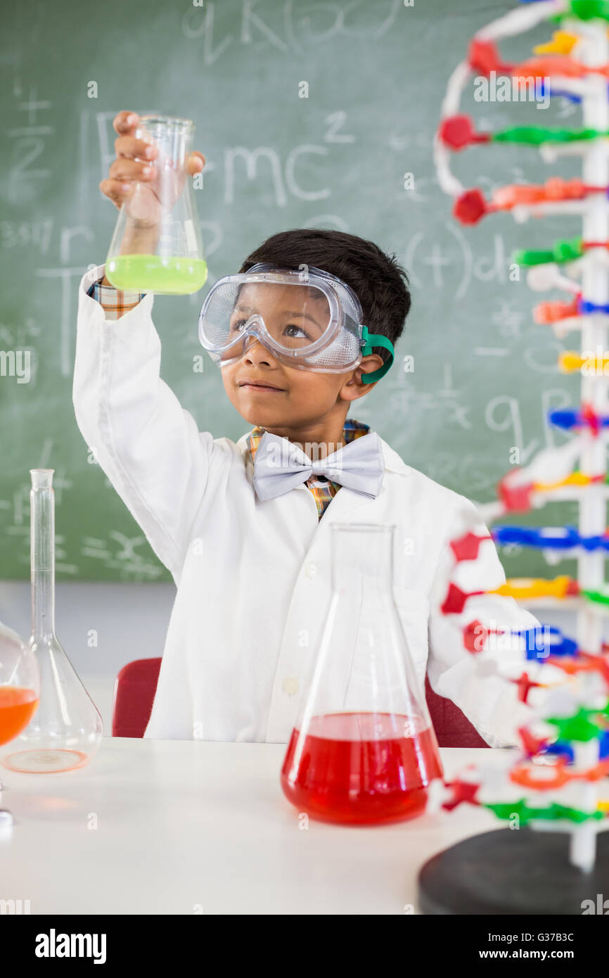Schoolboy doing a chemical experiment in laboratory Stock Photo - Alamy
