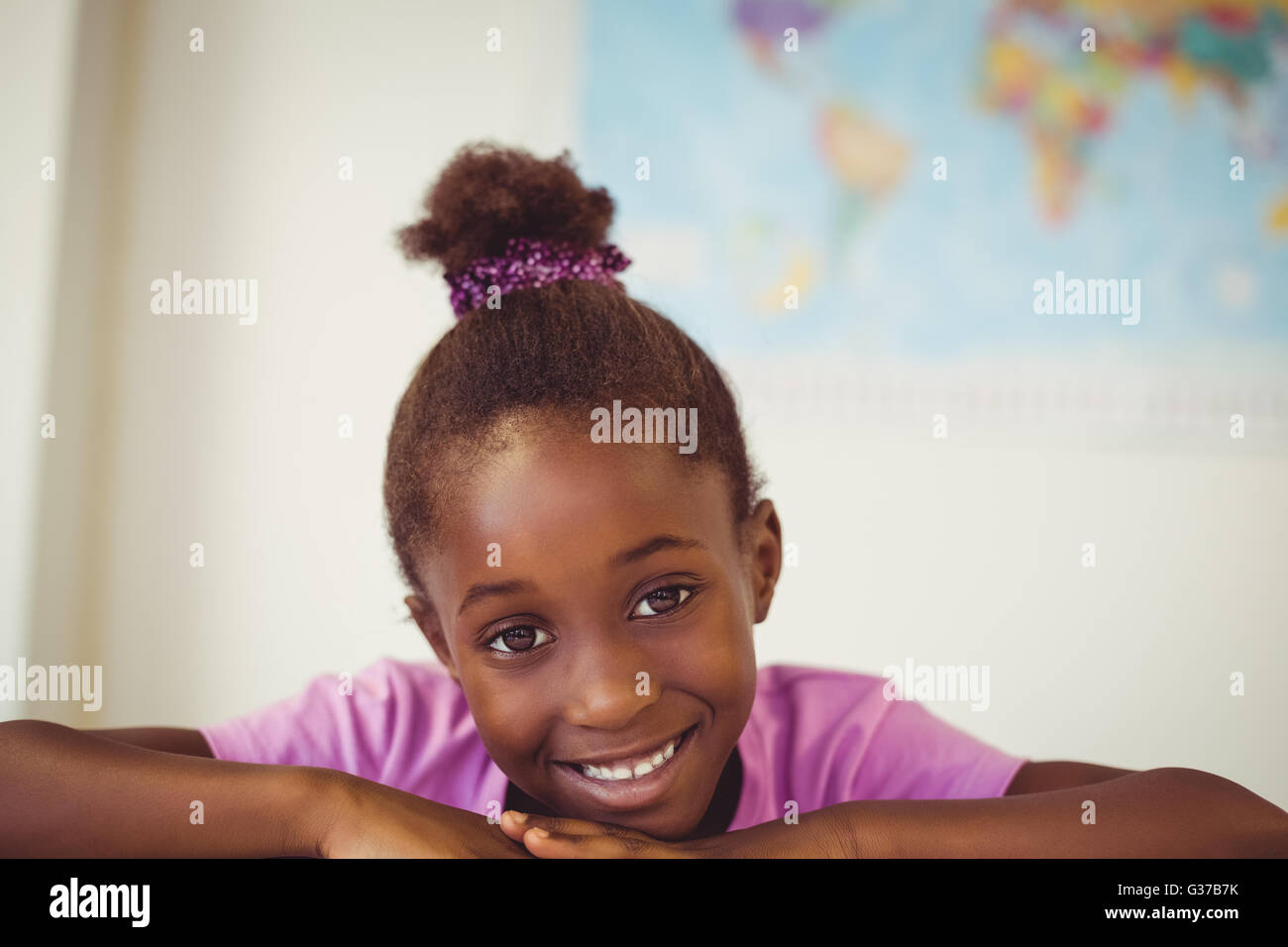 Portrait of smiling girl in classroom Stock Photo - Alamy