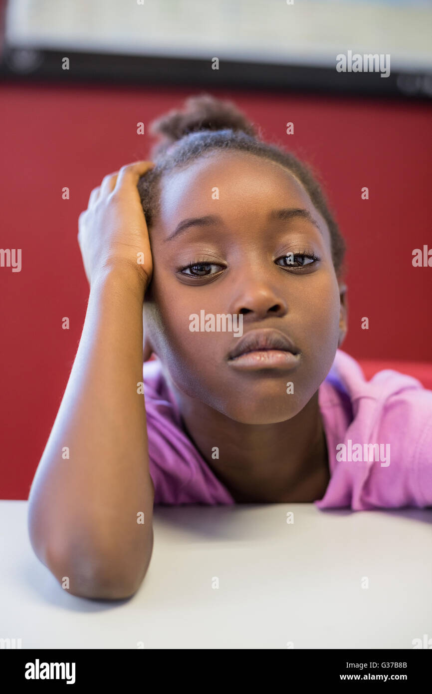 Girl sitting table black hi-res stock photography and images - Alamy
