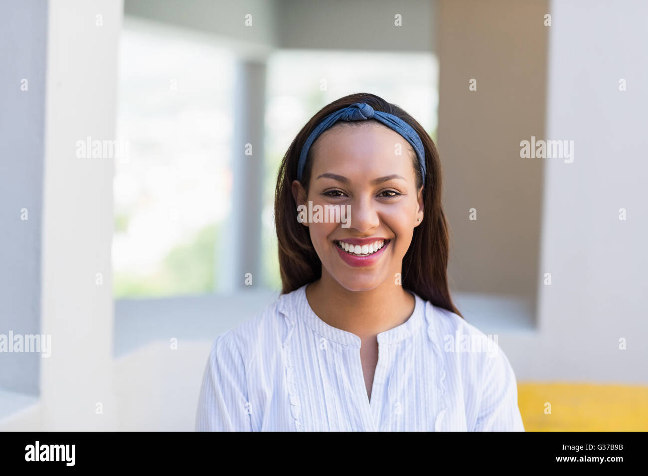 Portrait of smiling school teacher in classroom Stock Photo - Alamy