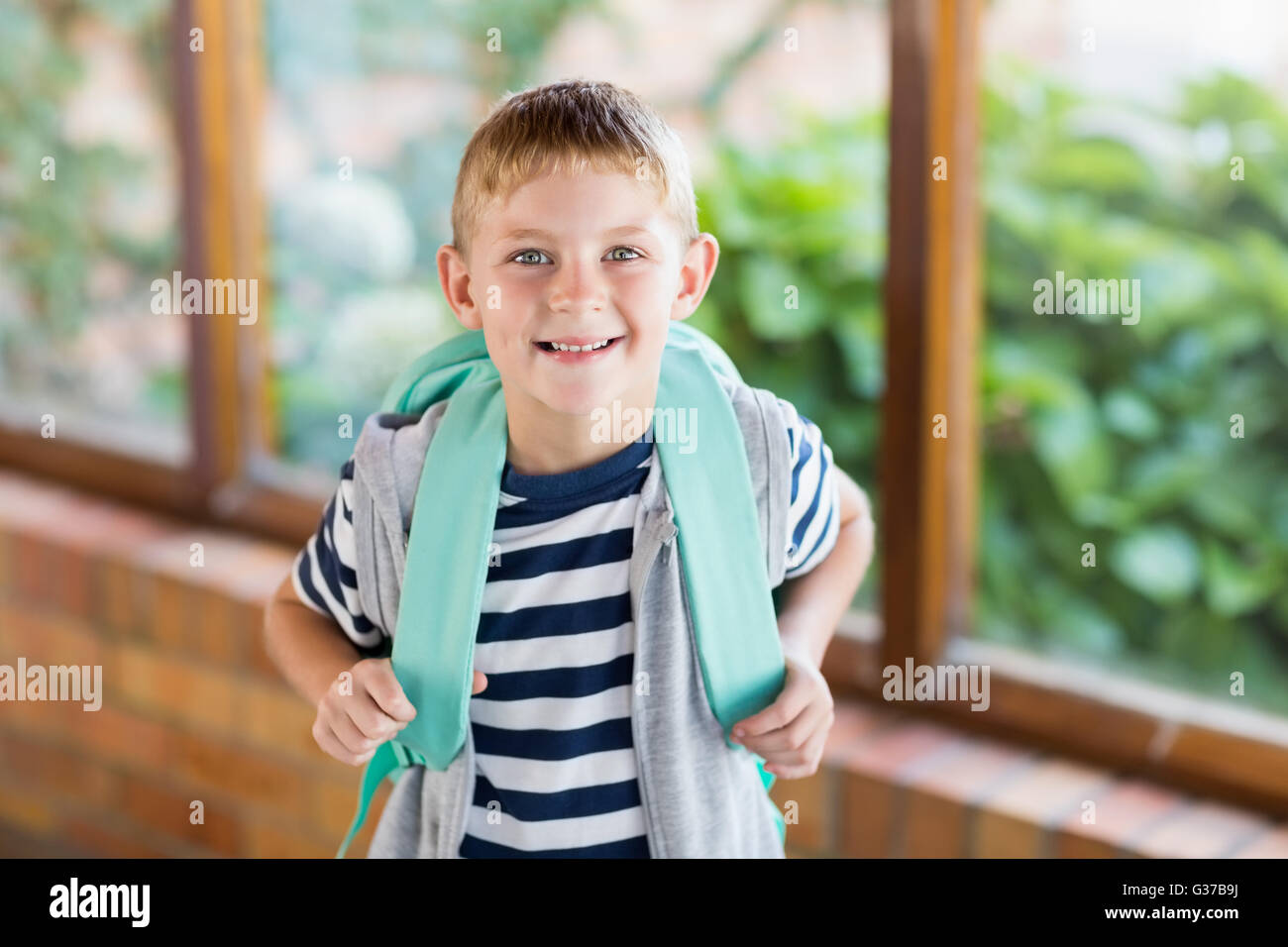 Portrait of happy schoolboy smiling Stock Photo - Alamy