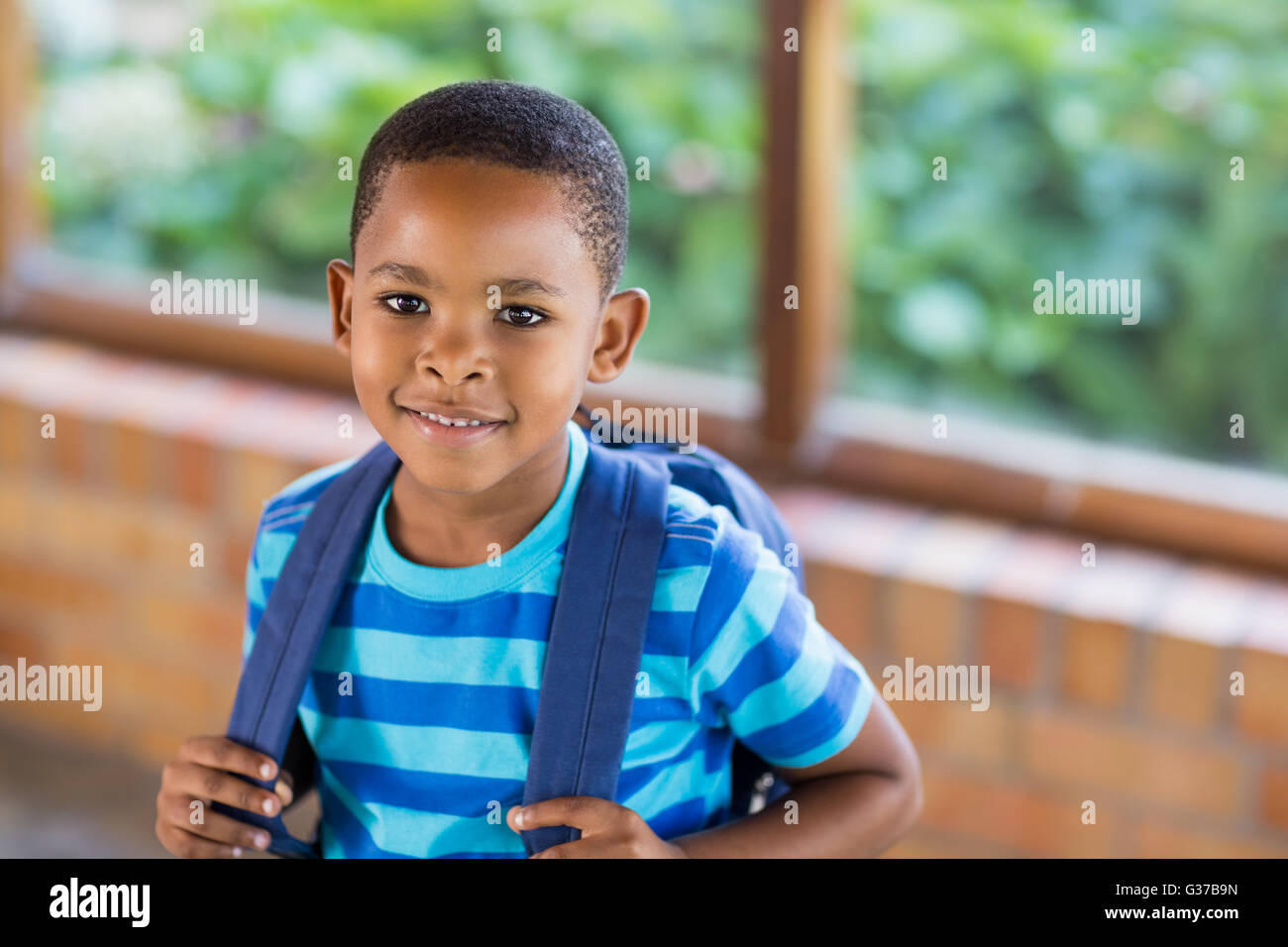 Portrait of happy schoolboy smiling Stock Photo - Alamy