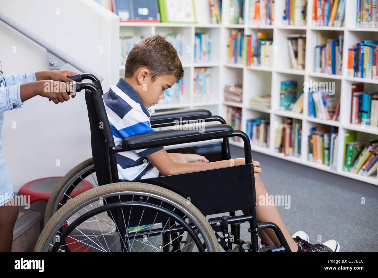 Boy pushing boy wheelchair hi-res stock photography and images - Alamy