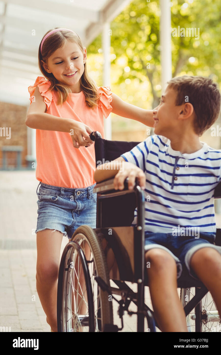 Boy pushing boy wheelchair hi-res stock photography and images - Alamy