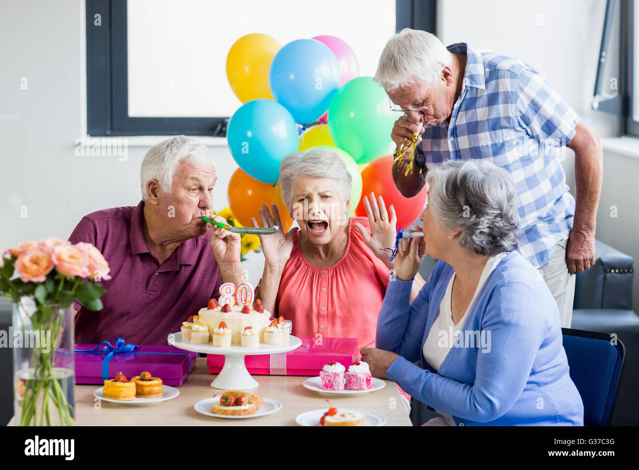 Seniors celebrating a birthday Stock Photo Alamy