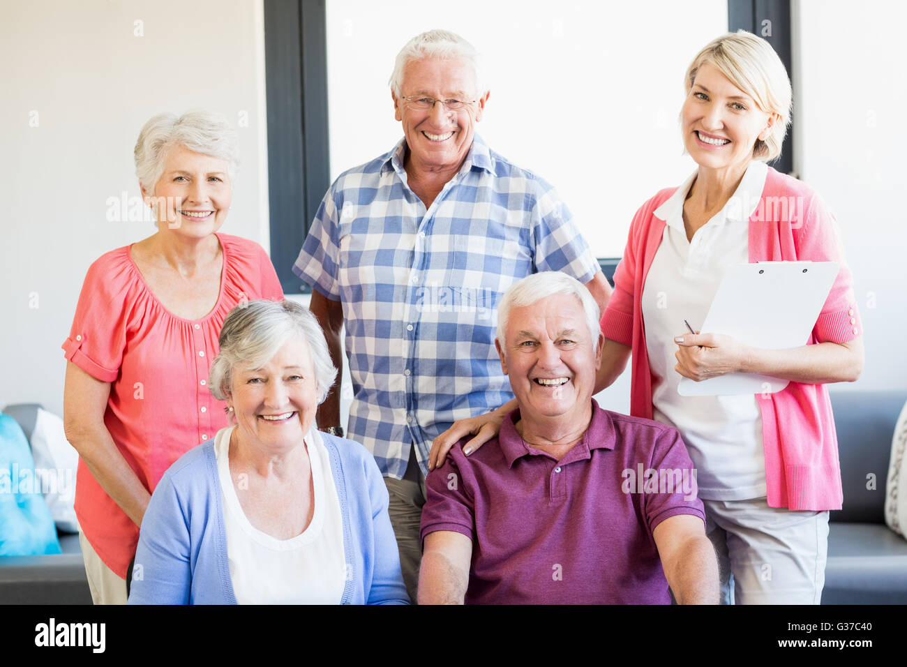 Nurse and seniors standing together Stock Photo