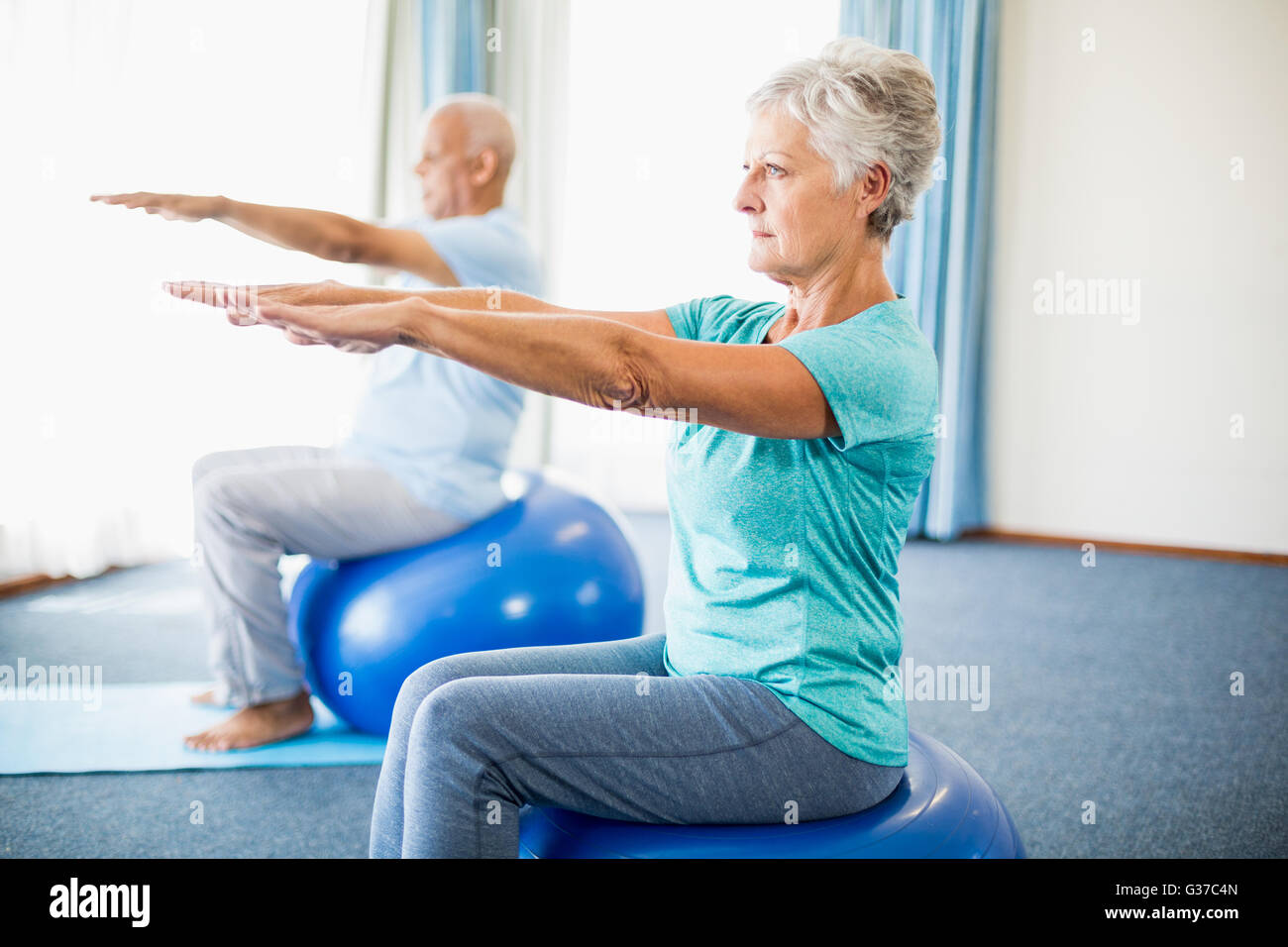 Seniors using exercise ball Stock Photo Alamy
