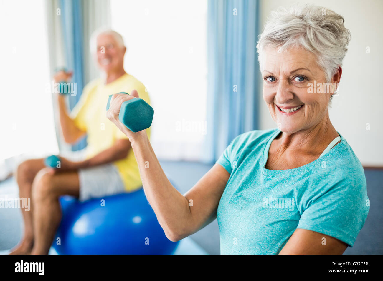 Seniors using exercise ball and weights Stock Photo Alamy
