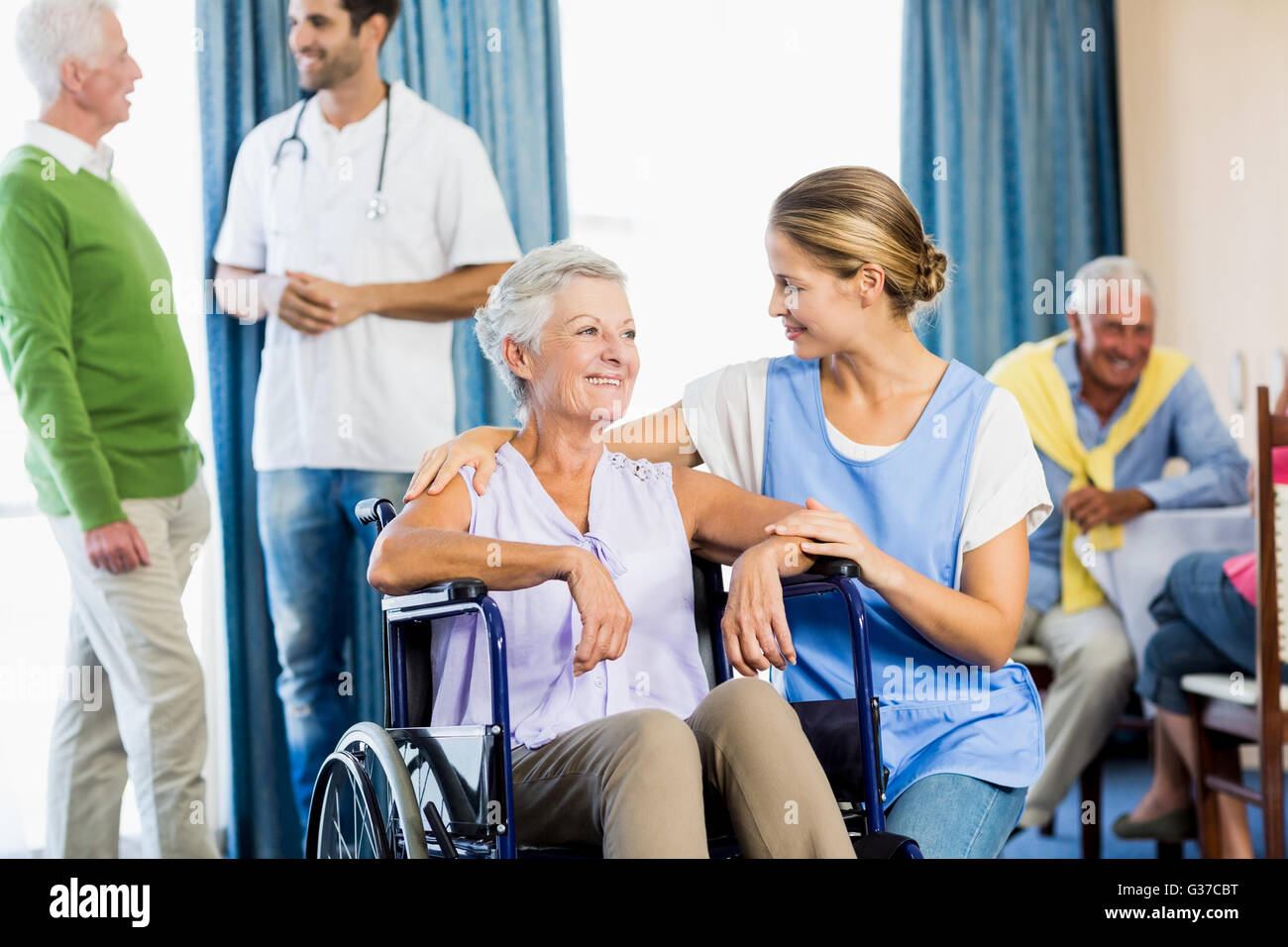Nurses taking care of seniors Stock Photo