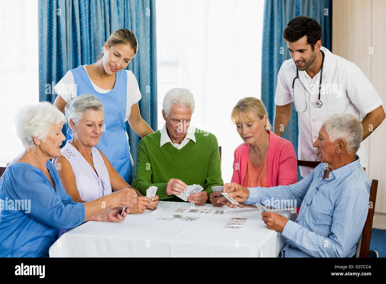Seniors playing cards Stock Photo