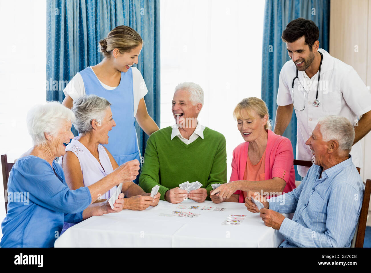 Seniors playing cards Stock Photo