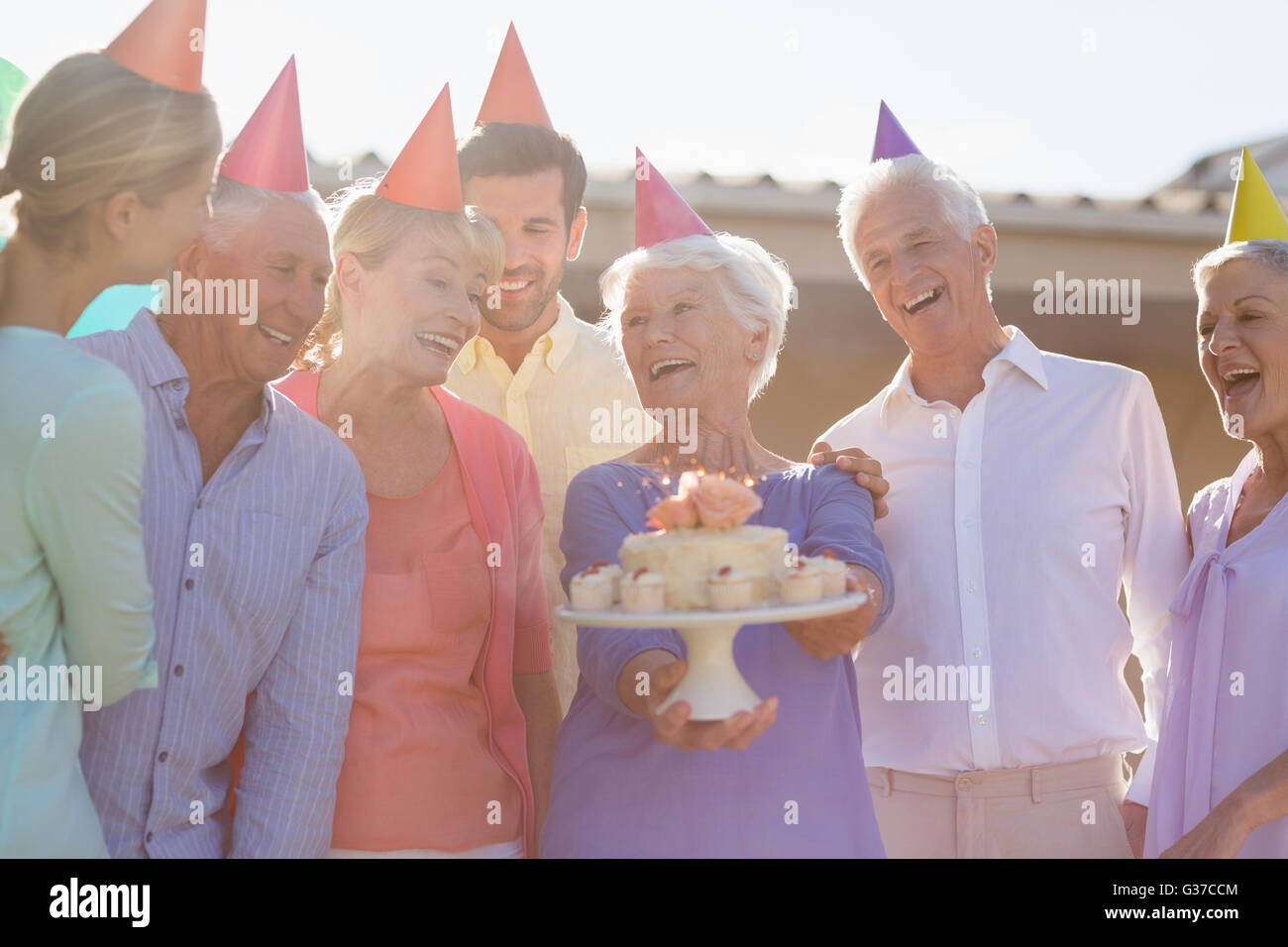 Nurse and seniors celebrating a birthday Stock Photo