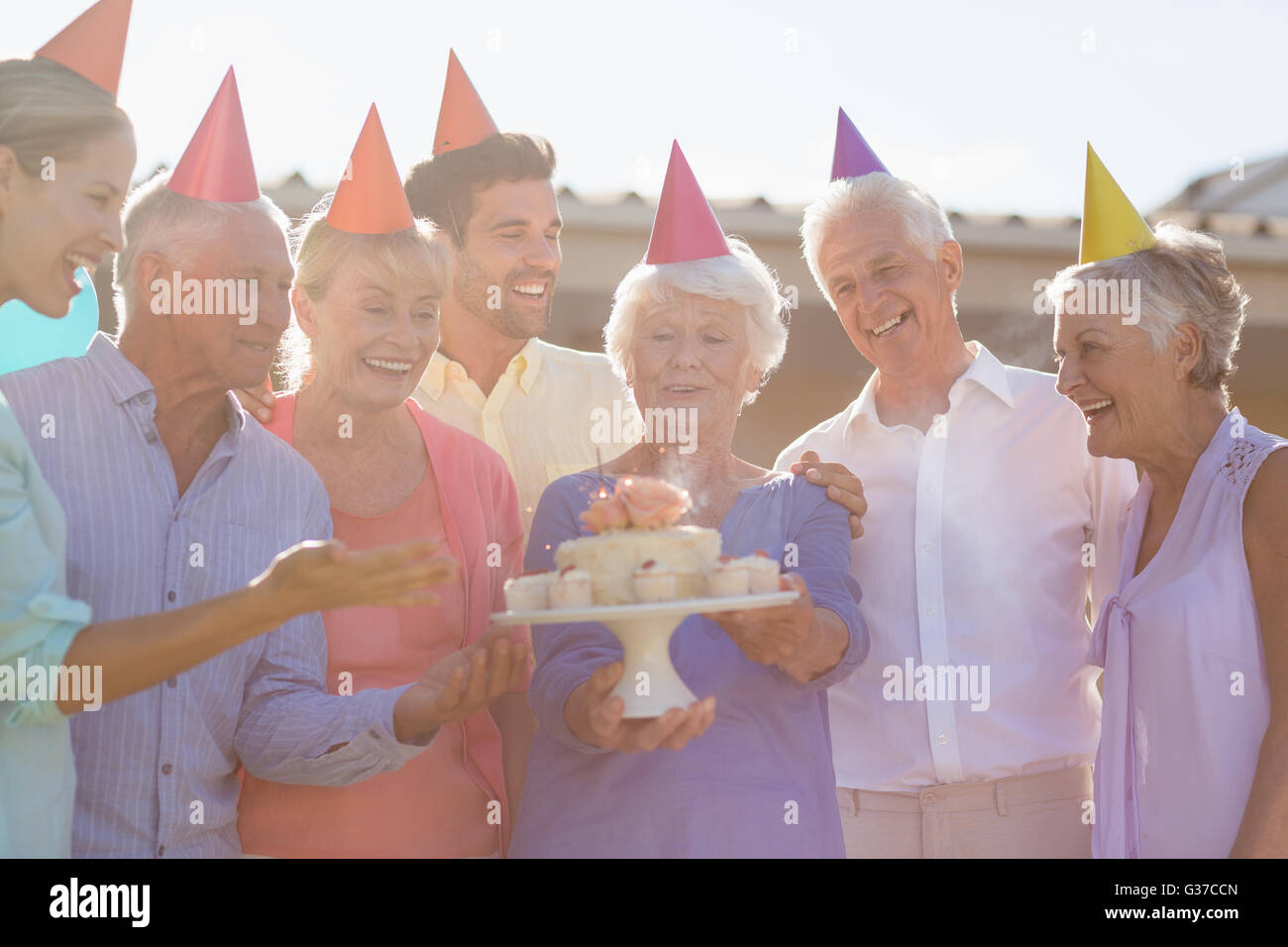 Nurse and seniors celebrating a birthday Stock Photo