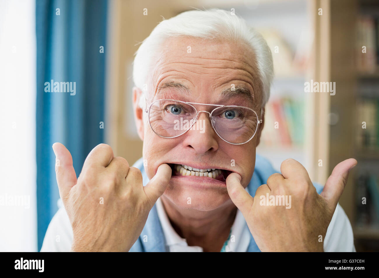 Senior man making faces Stock Photo