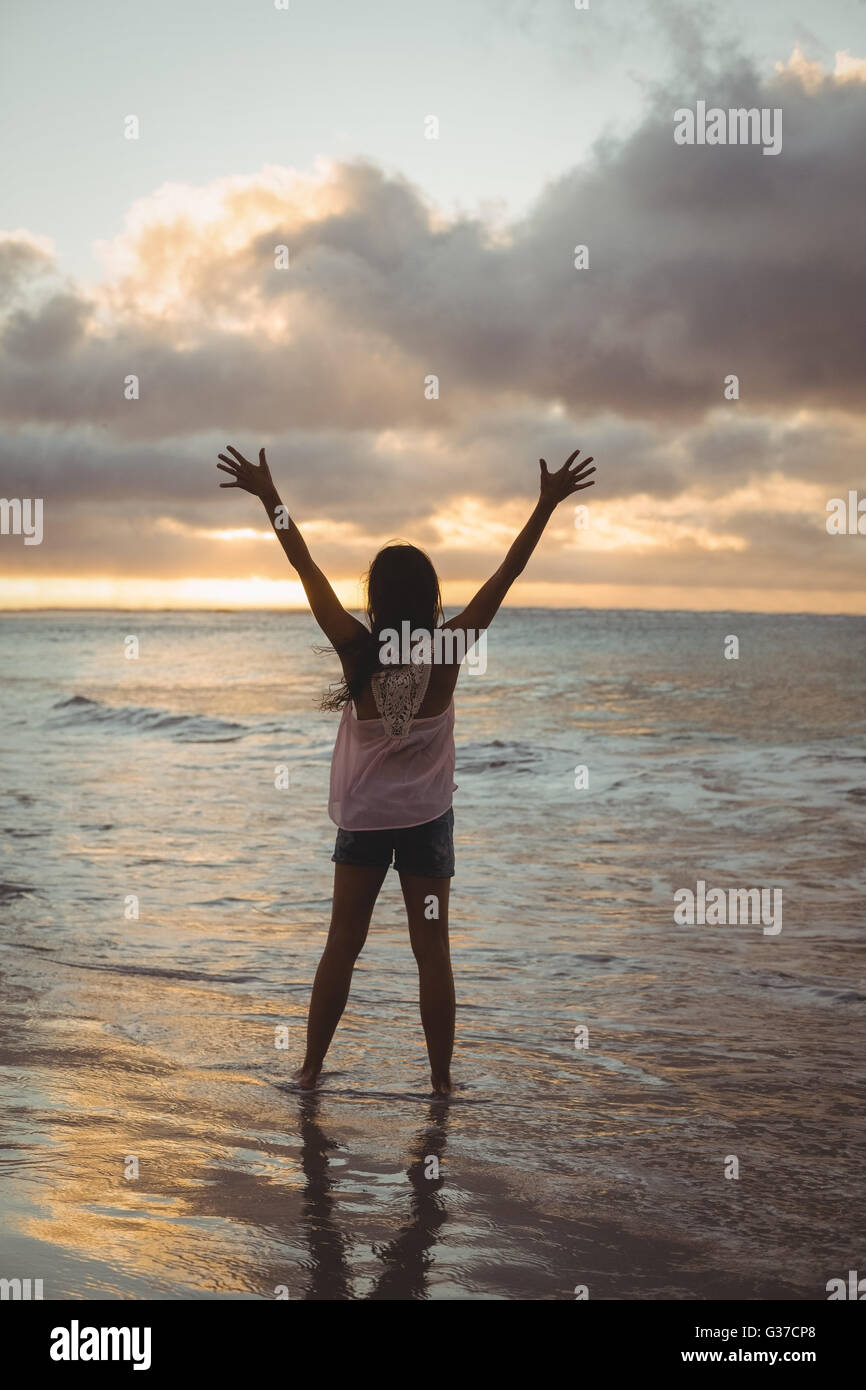 Woman standing sea raised arms hi-res stock photography and images - Alamy