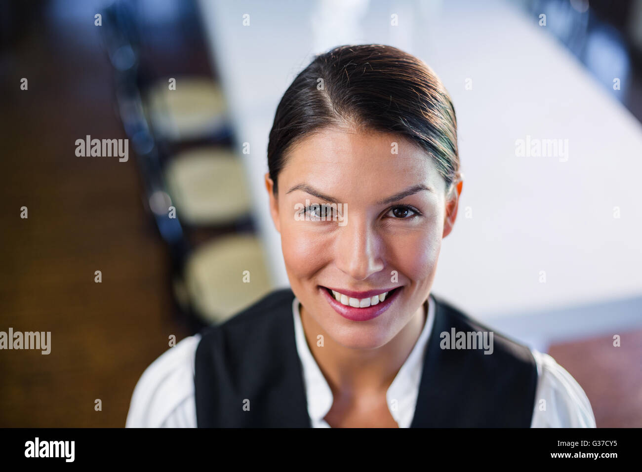 Portrait of smiling waitress Stock Photo