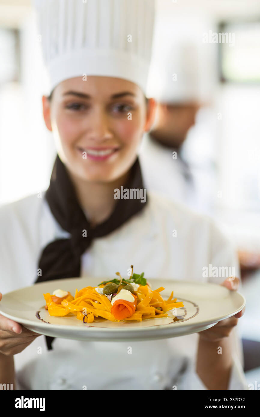 Happy head chef presenting her food Stock Photo