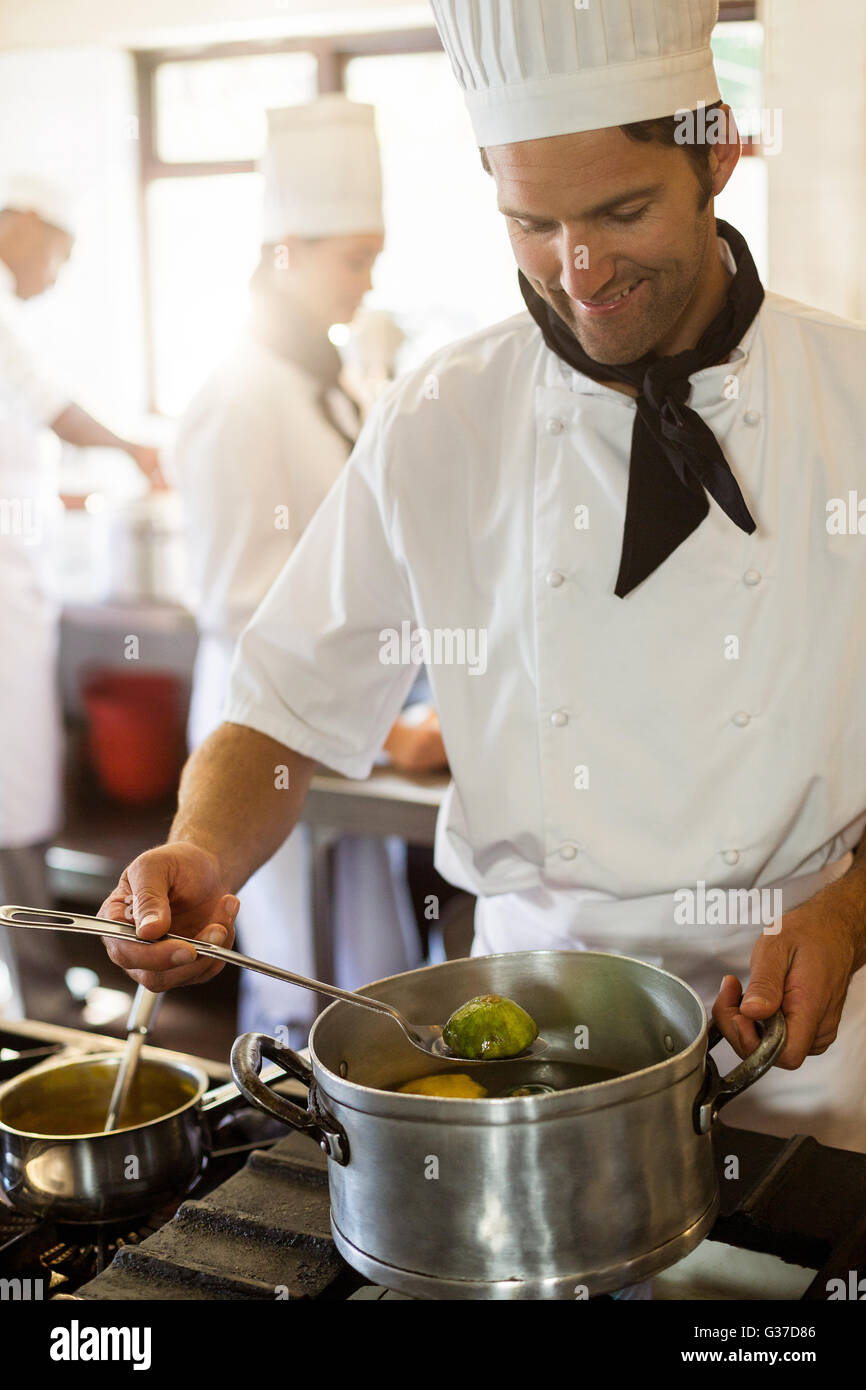 Stirring large pot hi-res stock photography and images - Alamy