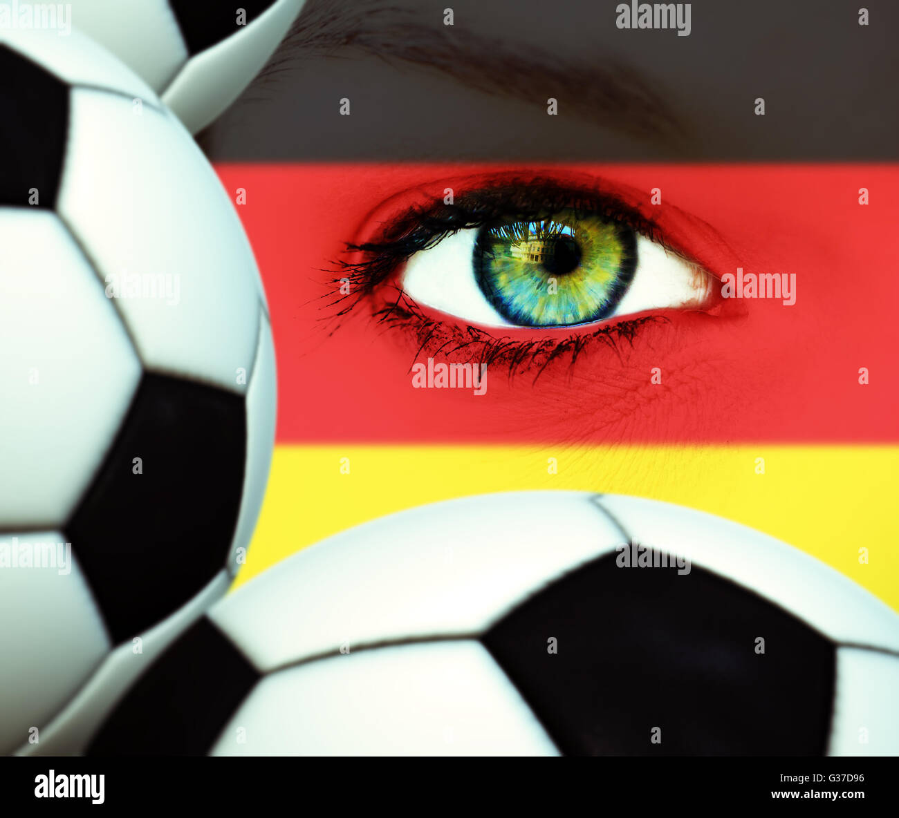 Face with german painting and soccerballs Stock Photo