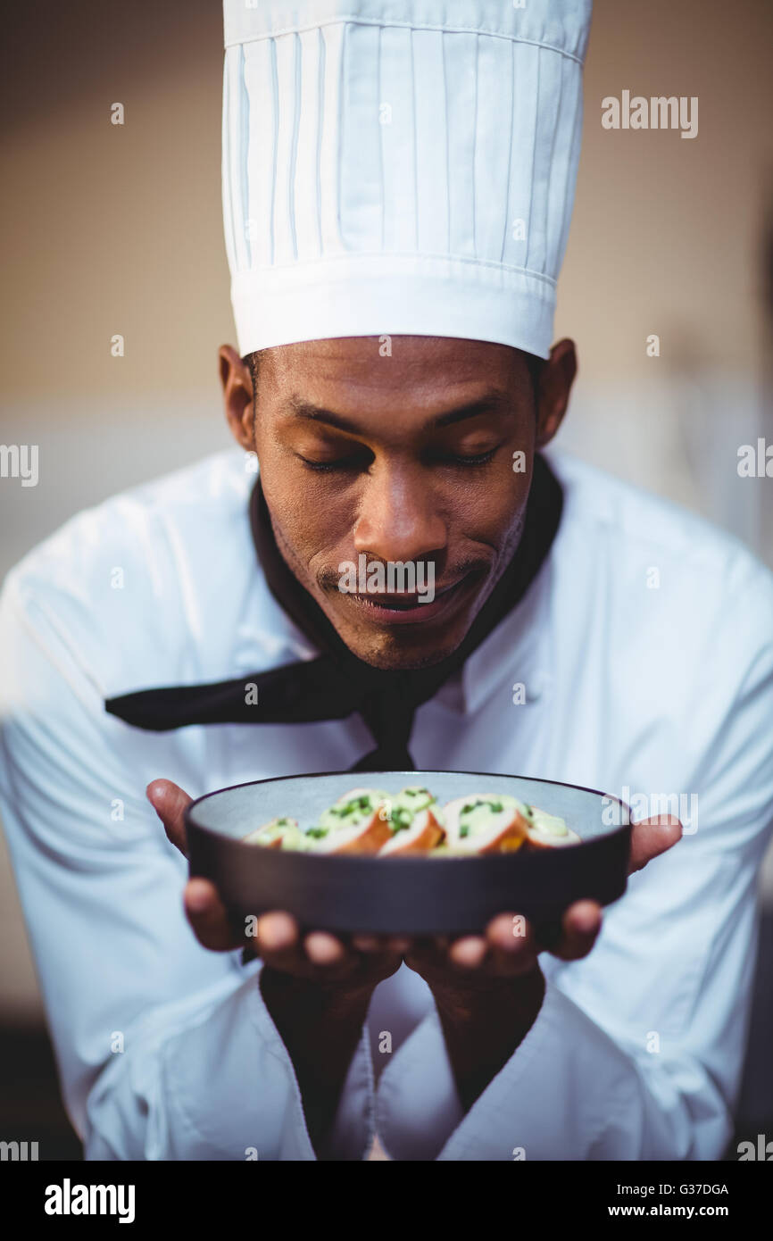 Close-up of head chef presenting salad Stock Photo