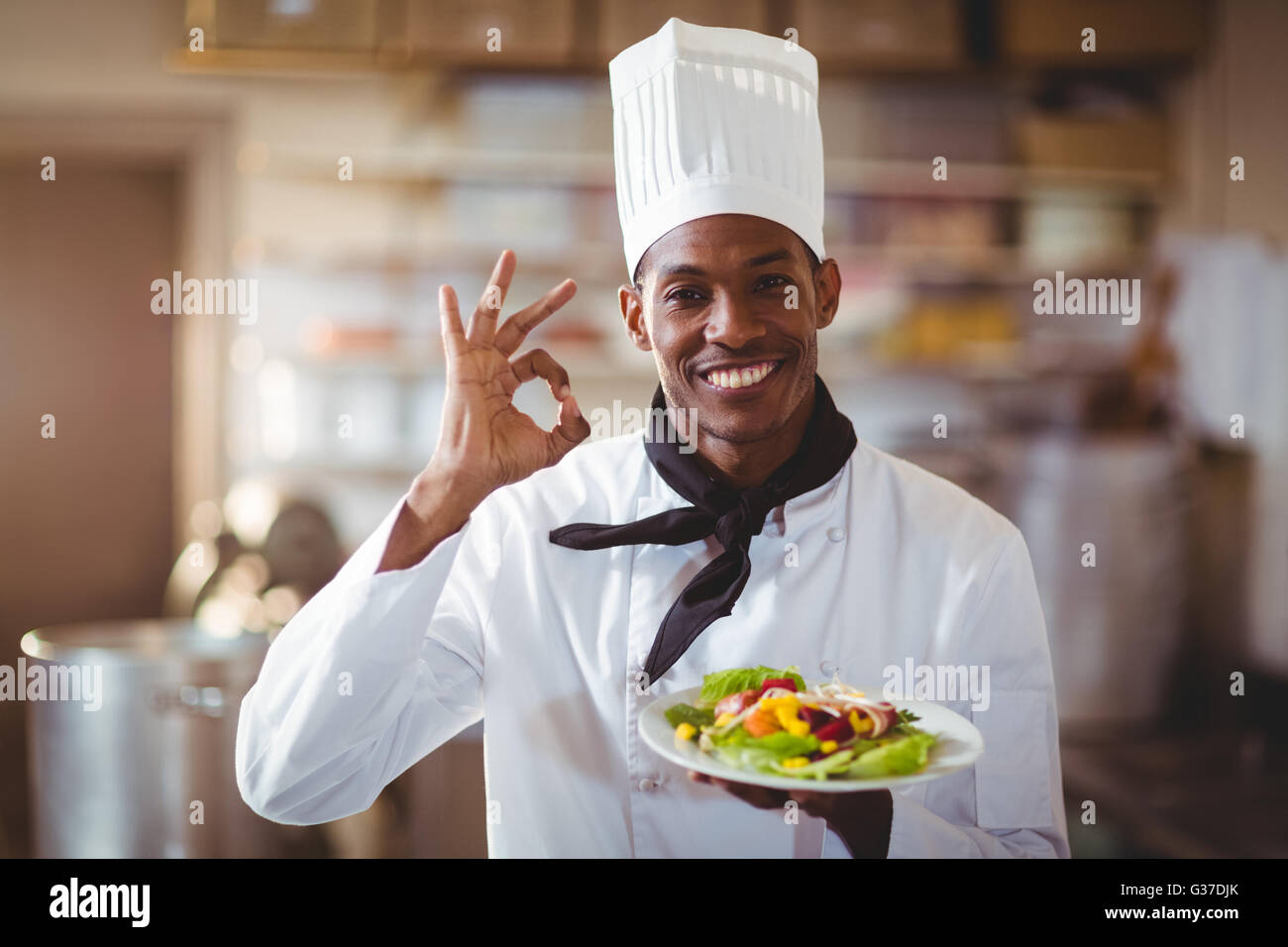 Portrait of happy chef making ok sign Stock Photo - Alamy
