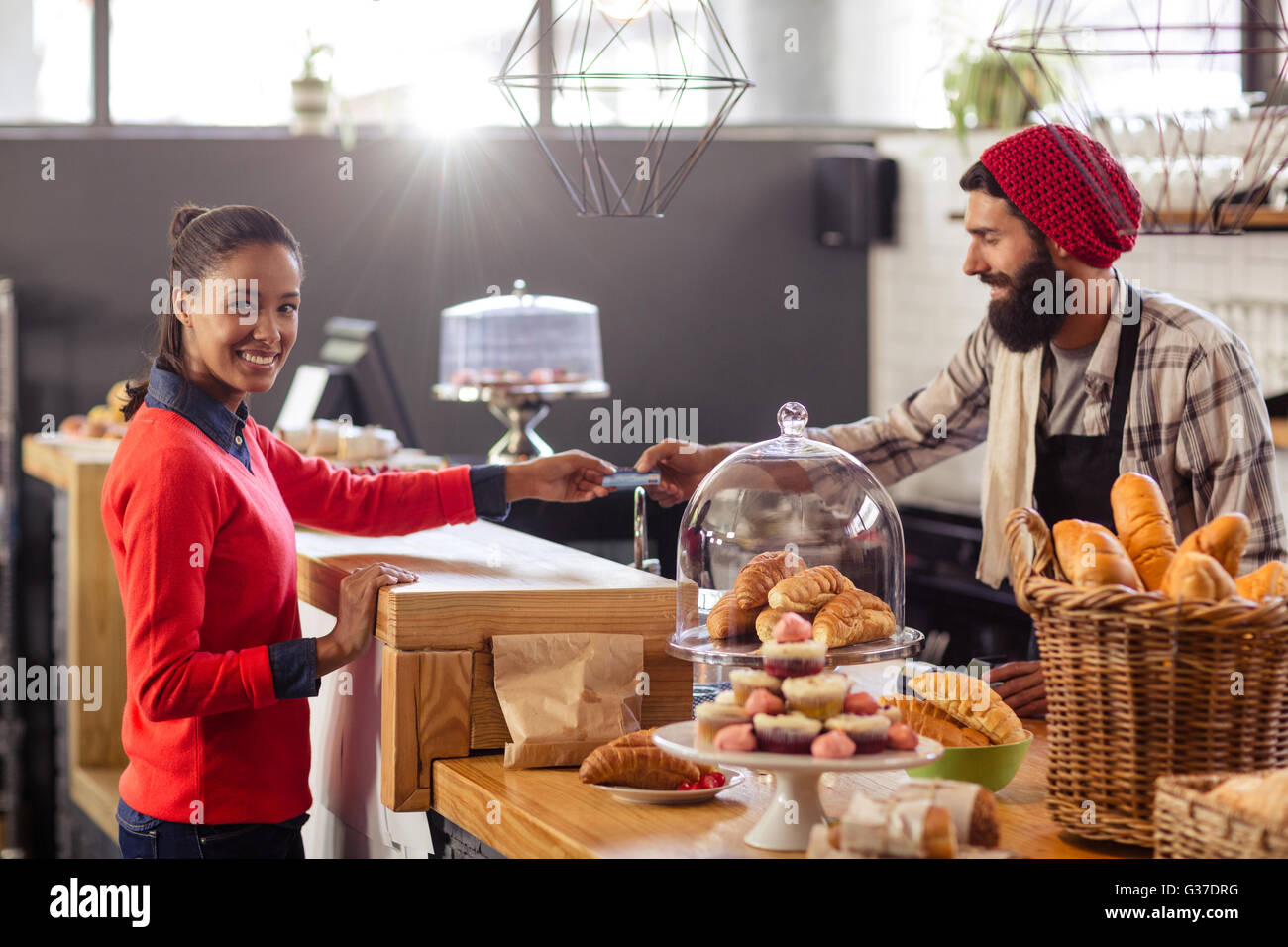 Seller taking payment with bank card reader Stock Photo