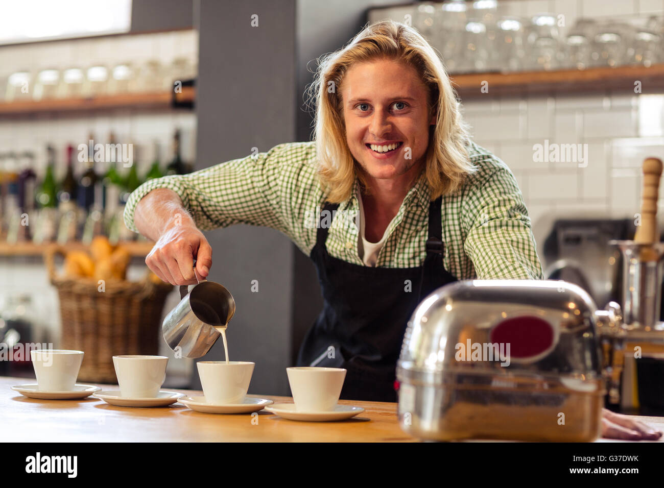 Bartender serving coffees Stock Photo