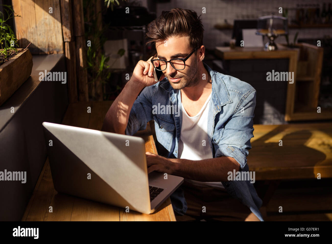 Man making a phone call Stock Photo - Alamy