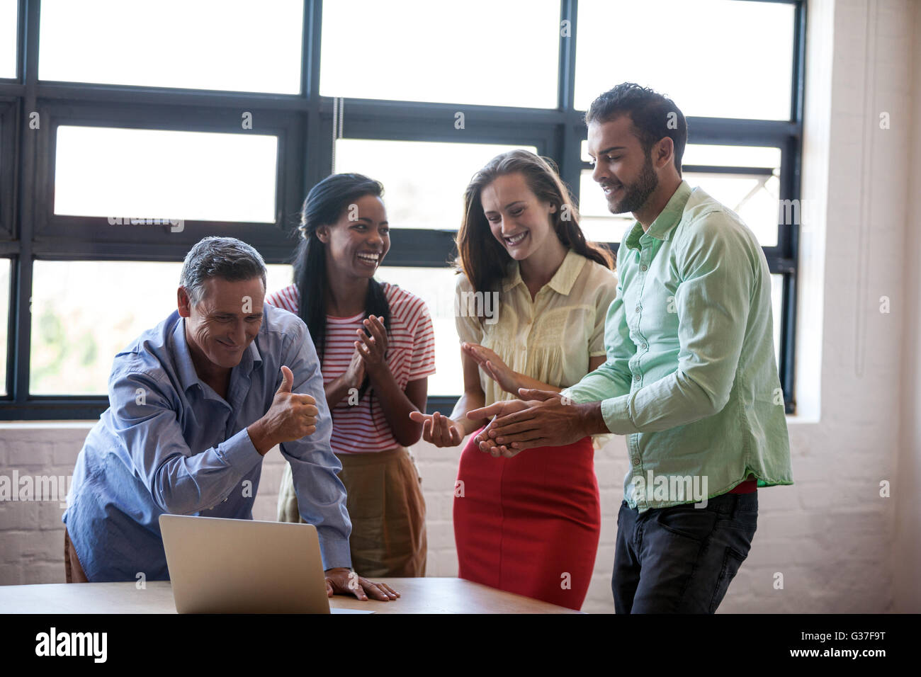 Business team congratulating themselves Stock Photo