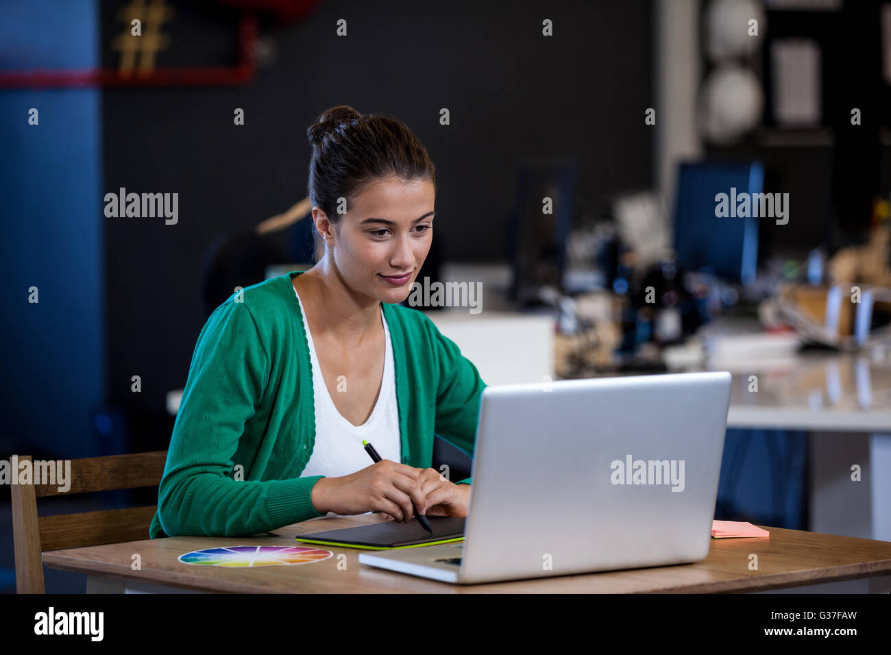 Businesswoman taking notes on her tablet computer Stock Photo Alamy