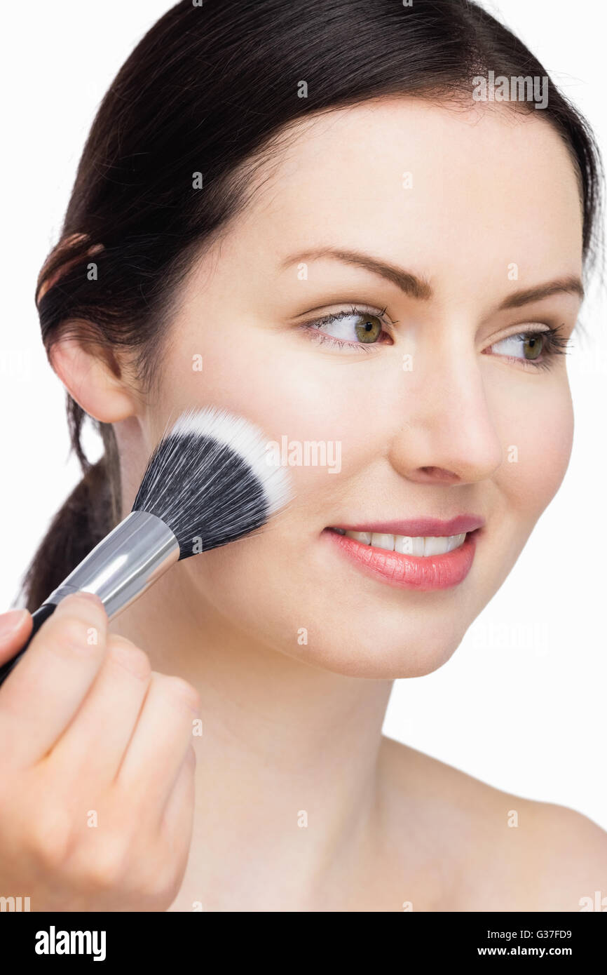 Gorgeous Woman applying makeup Stock Photo