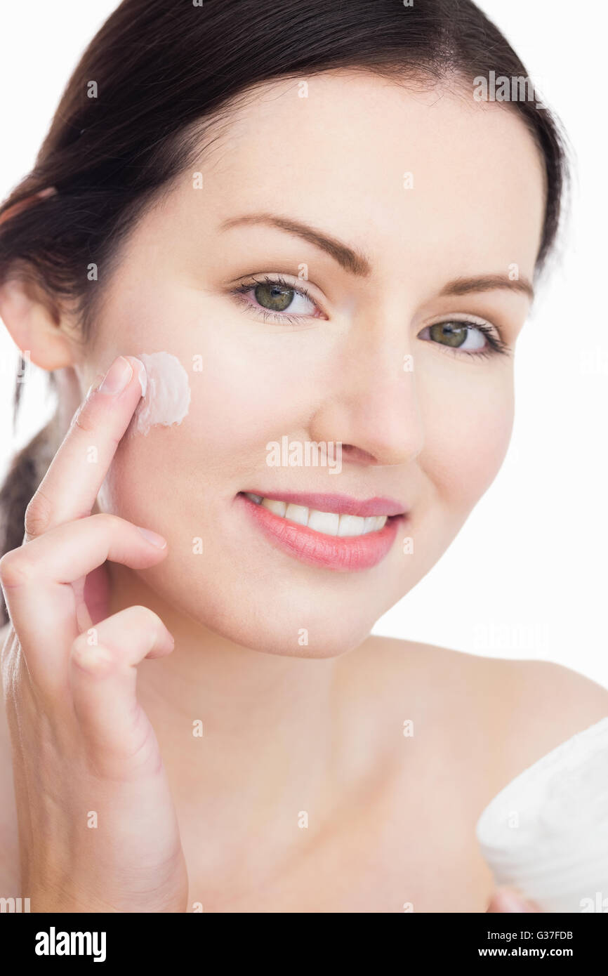 Woman applying a cream Stock Photo Alamy