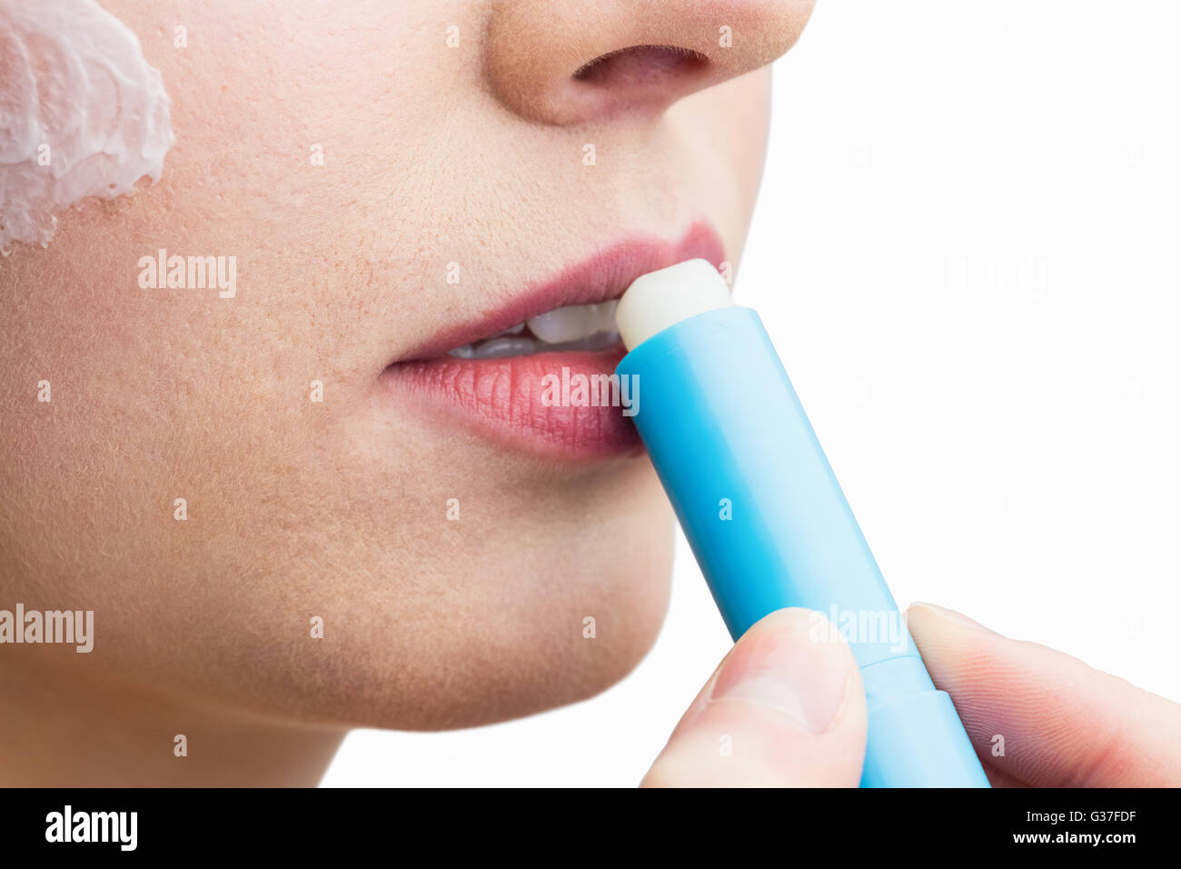 Woman applying lipstick Stock Photo