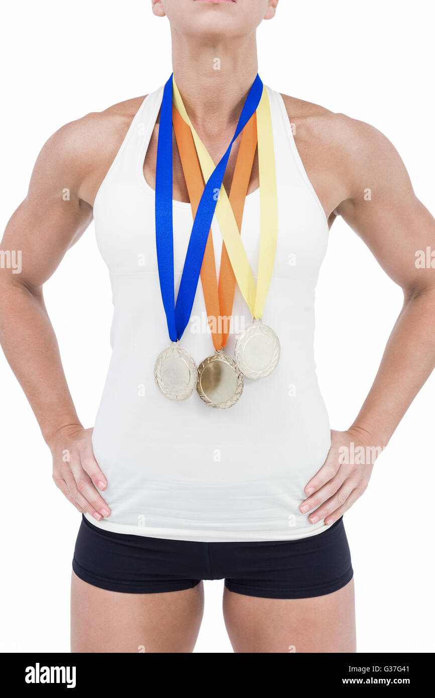 Female athlete wearing medals Stock Photo