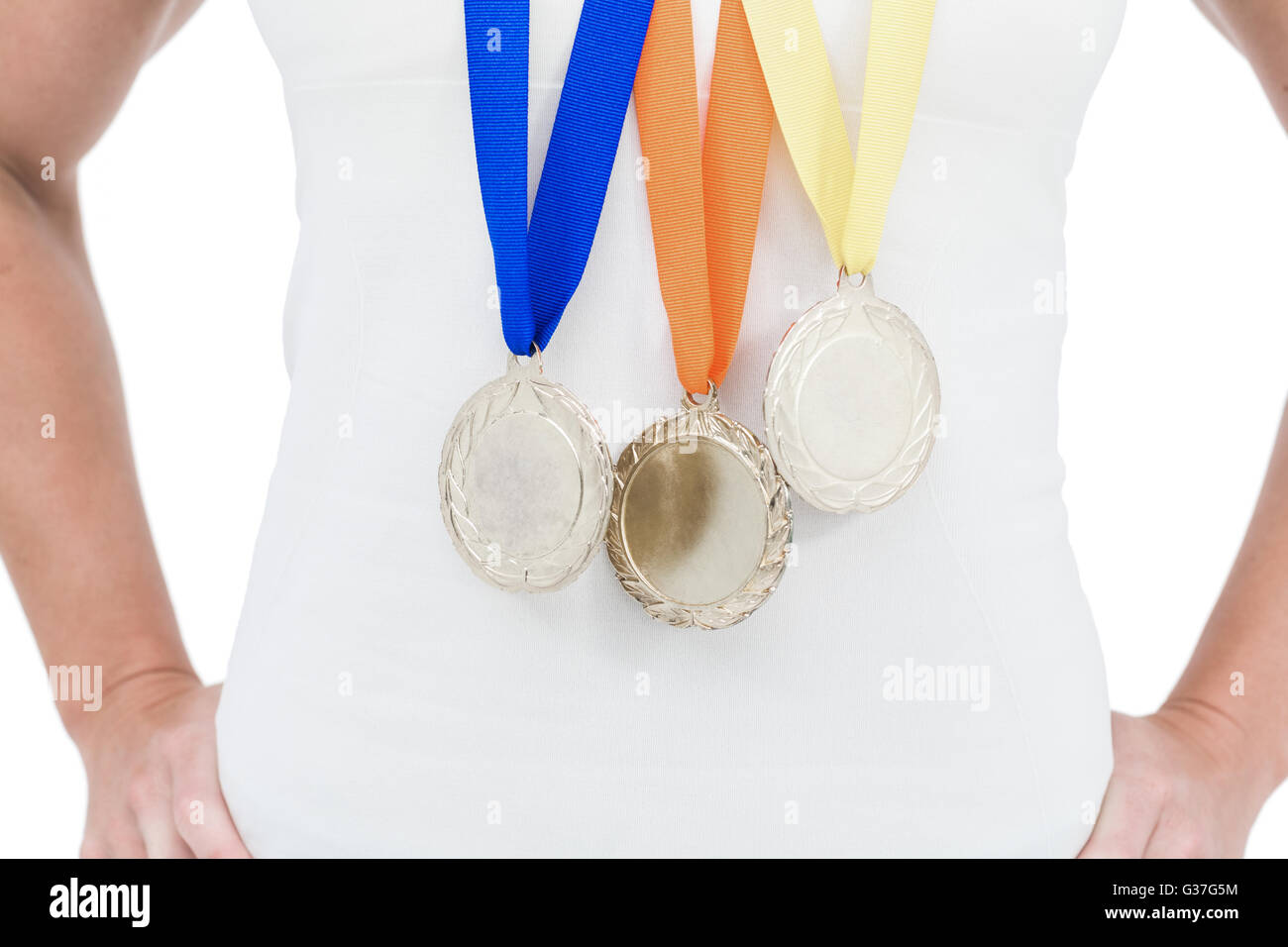 Female athlete wearing medals Stock Photo