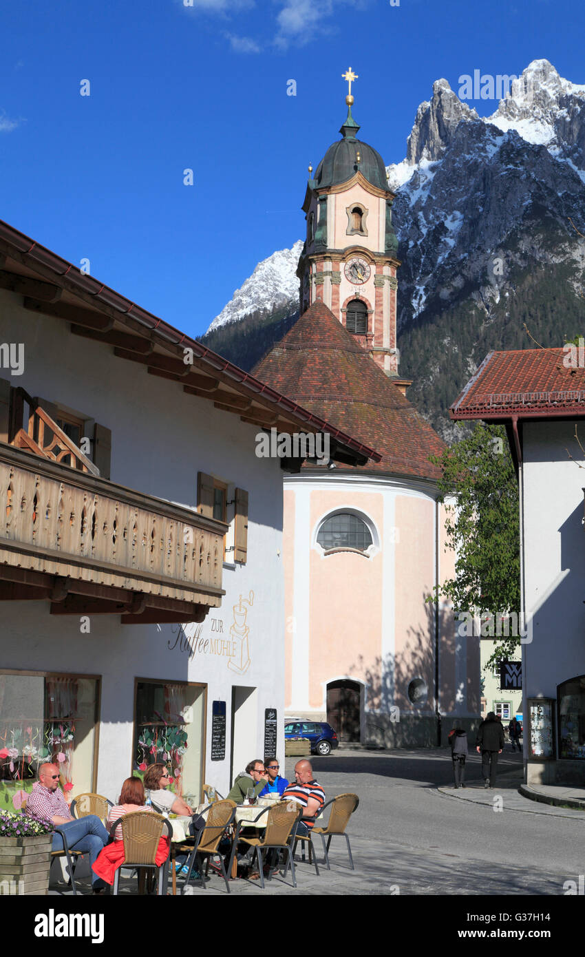 Germany, Bavaria, Alps, Mittenwald, church, mountain, people Stock ...