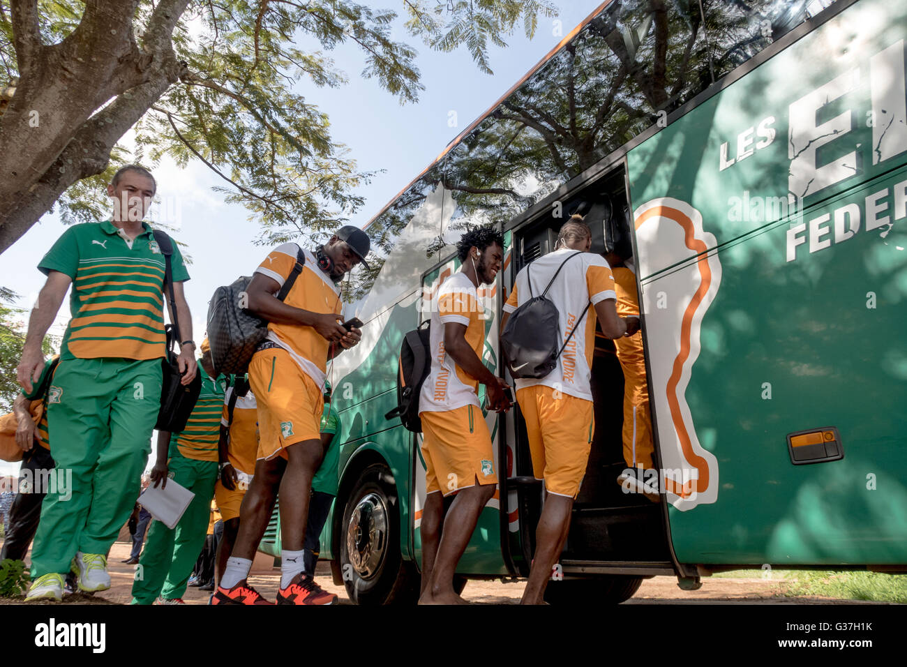 Coach Michel Dussuyer (L) boarding the bus with the Ivory Coast team ready to play a friendly against Gabon at Stade Bouaké Stock Photo