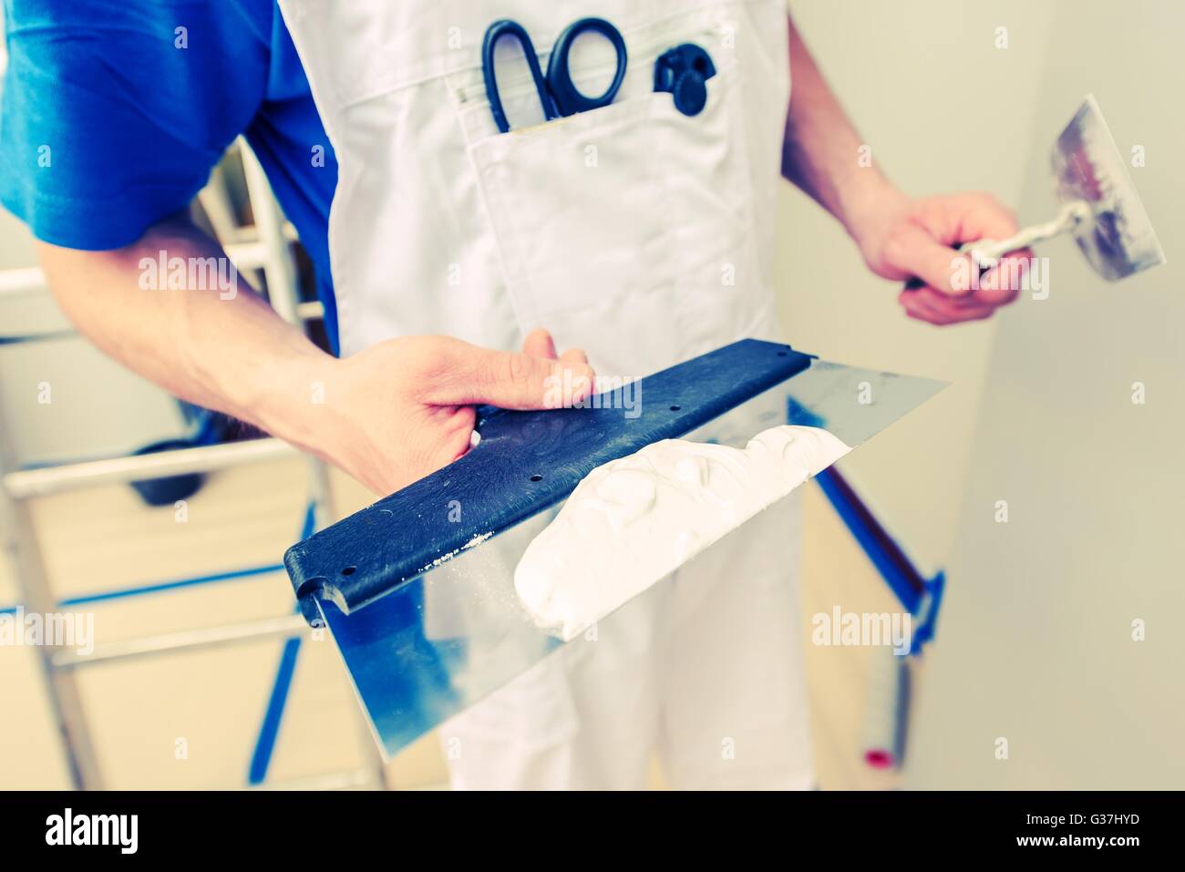 Drywall Patching Work. Caucasian Men Ready to Patch Drywall Holes. Stock Photo