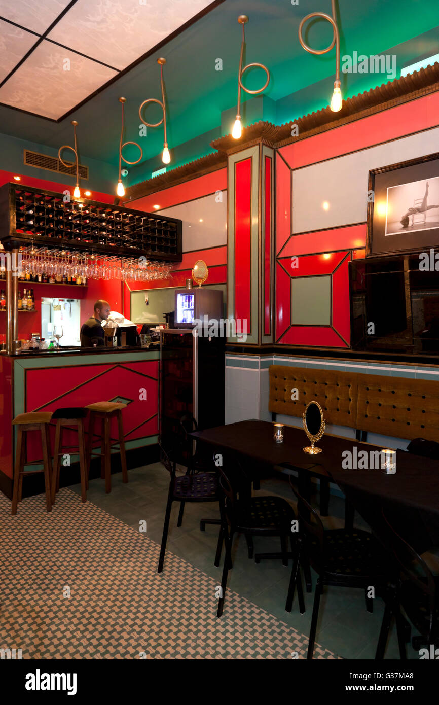 The retro decor and garish red-themed colours of the interior of Loop Bar, a retro bar in Strait Street in Valletta. Stock Photo