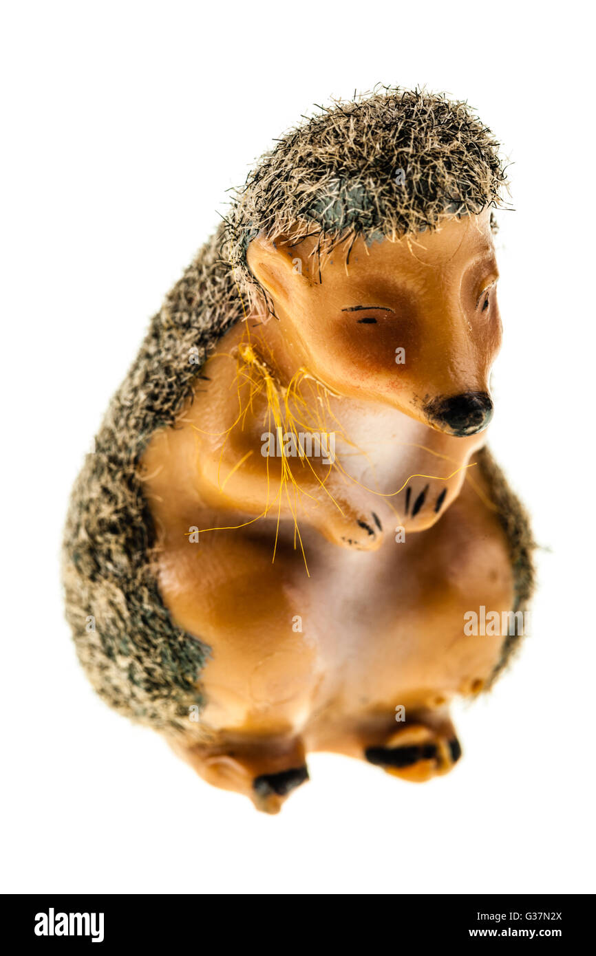 a plastic hedgehog figurine isolated over a white background Stock Photo